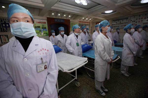 Doctors and nurses stand by to receive rescued miners of the flooded Wangjialing Coal Mine at Hejin People&apos;s Hospital in Hejin, north China&apos;s Shanxi Province, April 6, 2010.