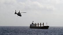 Special force soldiers of China's 5th escort flotilla move to a merchant ship by helicopter in the Gulf of Aden, April 11, 2010.