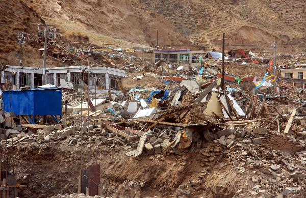 Photo taken on April 14, 2010 shows the ruins of collapsed houses after an earthquake in Yushu County, northwest China's Qinghai Province. 
