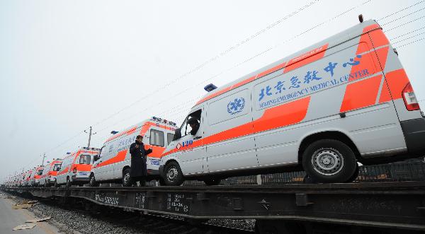 Ambulances are loaded on a train leaving for the quake-hit Yushu County in Beijing, capital of China, April 15, 2010. 20 ambulances left here on Thursday for the 7.1-magnitude-earthquake-hit Qinghai Province.