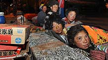 Residents rest at a square in Tibetan Autonomous Prefecture of Yushu, northwest China's Qinghai Province, April 15, 2010.