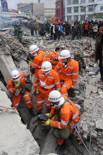 Rescuers from Qingdao of east China&apos;s Shandong Province use visual life-ditector to search for survivors among debris of Minzu Hotel at Gyegu Town of earthquake hit Yushu County of northwest China&apos;s Qinghai Province, April 16, 2010. The rescuers have been doing unremitting efforts to save people&apos;s lives during the &apos;golden 72 hours&apos; since the 7.1-magnitude quake struck Yushu early Wednesday. 