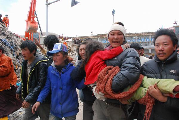 People carry a girl who is rescued from debris of Minzu Hotel to receive medical treatment at Gyegu Town of earthquake hit Yushu County of northwest China&apos;s Qinghai Province, April 16, 2010. She was rescued out of the debris at 14:00 p.m. after 6-hour-effort of members of the China National Earthquake Disaster Relief Team. Rescuers have been doing unremitting efforts to save people&apos;s lives during the &apos;golden 72 hours&apos; since the 7.1-magnitude quake struck Yushu early Wednesday.