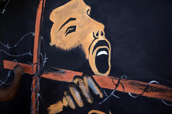 A graffiti painted by a Palestinian to mark the Palestinian prisoner day is seen in Gaza city on April 16, 2010. 