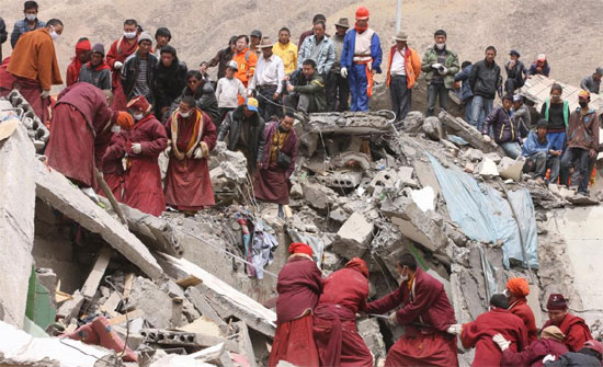 Rescuers and local monks search for victims in the ruins of a 7.1-magnitude earthquake hit Yushu Tibetan Autonomous Prefecture in Qinghai province early on Wednesday.