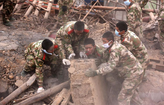 Rescuers search for victims in the ruins of a 7.1-magnitude earthquake hit Yushu Tibetan Autonomous Prefecture in Qinghai province early on Wednesday. 