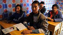 High school students attend class at the No. 1 High School for Nationalities of the quake-hit Tibetan Autonomous Prefecture of Yushu, northwest China's Qinghai Province, April 18, 2010. The school resumed its classes on Sunday. A 7.1-magnitude quake struck Yushu Wednesday morning.