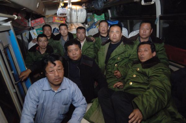 Ten farmers from China&apos;s Hebei Province sit in a mini-bus full of relief goods after they arrive in the quake-hit Yushu Tibetan Autonomous Prefecture of northwest China&apos;s Qinghai Province, April 19, 2010. They set off on April 15 and purchased 170 quilts, 78 cotton-padded clothes and three tents on their way to the quake-hit area.