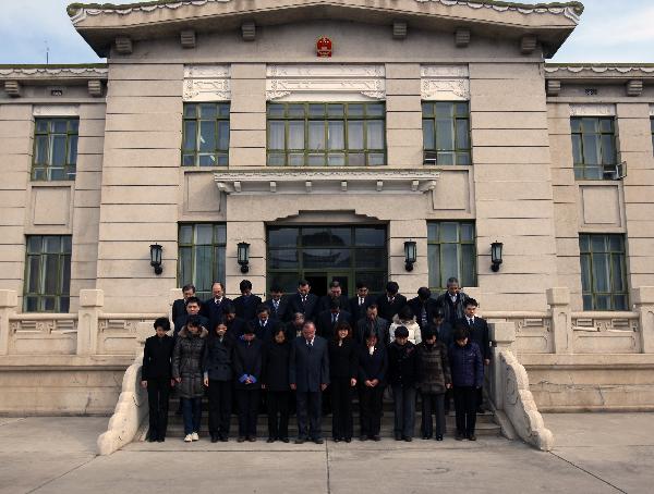 Chinese national flag on the roof of telegraph building flies at half-mast to mourn the victims of Yushu earthquake, in Beijing, China, April 21, 2010