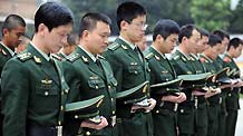 Frontier guards mourn for the victims of Yushu earthquake, in Shishi of southeast China's Fujian Province, April 21, 2010.