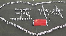 Students from Tianjin Medical University stand in a heart shape while praying for the quake victims in Yushu prefecture of China's Northwest Qinghai Province on April 21, 2010.