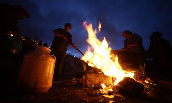 People of Tibetan ethnic group make ghee at a racecourse in quake-hit Tibetan Autonomous Prefecture of Yushu, northwest China's Qinghai Province, April 24, 2010. 