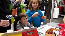 Kids drink organic milk on Union Square in New York, the United States, April 25, 2010.