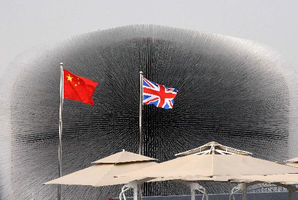 National flags of China and Britain are seen in front of the UK pavilion in the World Expo Park in Shanghai, east China, April 23, 2010. 