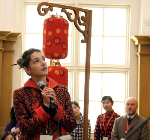 A contestant prepares to answer cultural knowledge questions during the British leg of the ninth 'Chinese Bridge' world university students' Chinese lauguage competition at the London School of Economics in London, capital of Britain, March 13, 2010. 