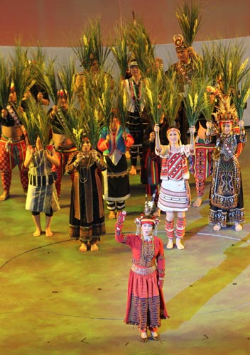 'Beating Drums and Singing Songs' is performed by actors of Tujia and Miao Ethnic Groups from central China's Hubei Province during the pre-ceremony performance ahead of the opening ceremony for the Shanghai World Expo at the Expo Cultural Center in Shanghai, east China, April 30, 2010. 