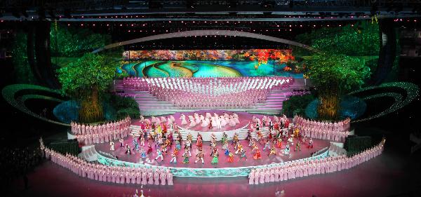Song Zuying and Jackie Chan sing &apos;Harmonious Gathering&apos; during the opening ceremony of the 2010 Shanghai World Expo at the Expo Cultural Center in Shanghai, east China, April 30, 2010.