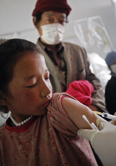 A child is vaccinated in Jiegu Town of northwest China's quake-hit Yushu Prefecture, on May 3, 2010. 