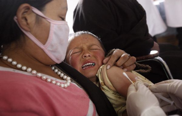A child is vaccinated in Jiegu Town of northwest China's quake-hit Yushu Prefecture, on May 3, 2010. 