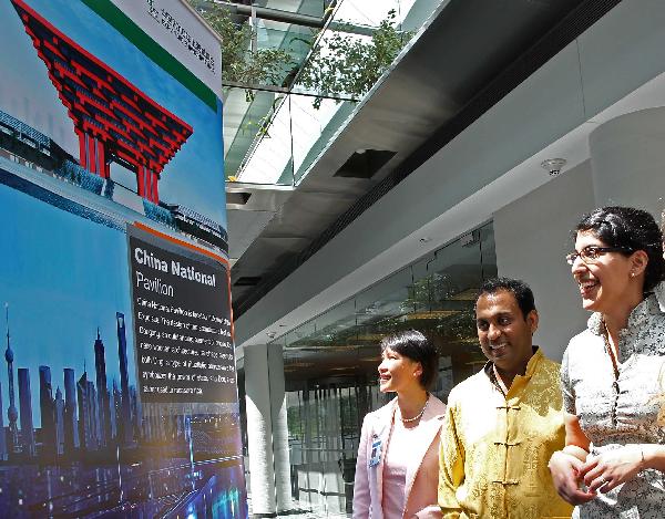 People visit a photo exhibition on the Shanghai World Expo 2010, in Toronto, Canada, May 3, 2010. The five-day photo exhibition opened here on Monday. 