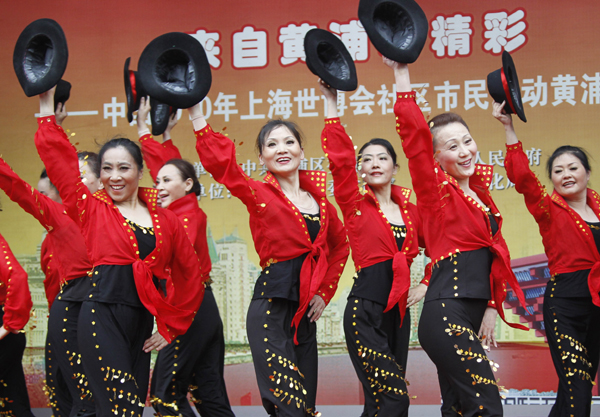 A dance group composed of elder women perform in the World Expo Park in Shanghai, east China, on May 5, 2010. 