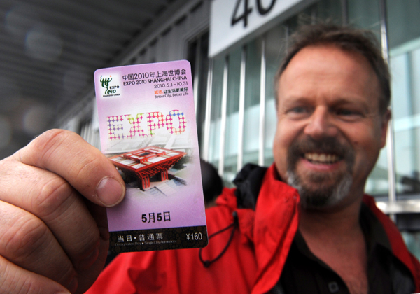 A tourist shows a ticket he just bought outside a ticket office of the World Expo Park in Shanghai, east China, on May 5, 2010.