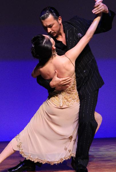 Actors perform Tango at Argentina Pavilion in the World Expo Park in Shanghai, east China, on May 5, 2010. 