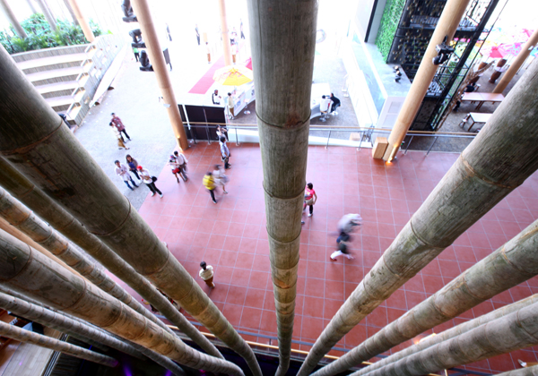 Tourists walk past huge-sized bamboo decorations in the Indonesia Pavilion in the World Expo in Shanghai, east China, on May 3, 2010.