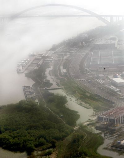 Photo taken on April 22, 2010 shows Houtan area, a wetland in Shanghai Expo Park. The colour of green is prevailing inside the World Expo Park, which embodies the idea of low-carbon expo, and makes the park environment enjoyable. 