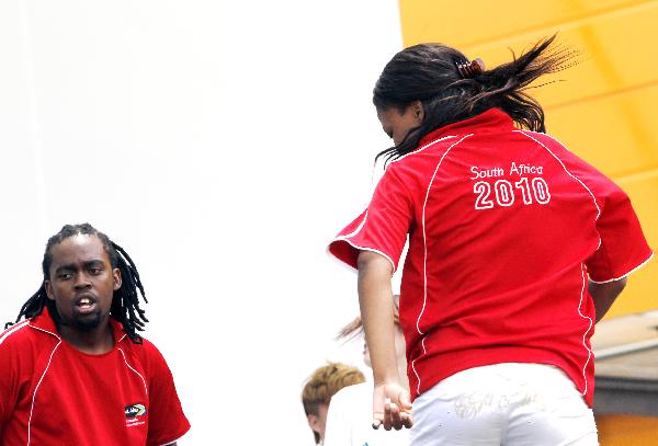 Actors perform at the opening ceremony of the South Africa Pavilion in Shanghai Expo, Shanghai, east China, on May 6, 2010.