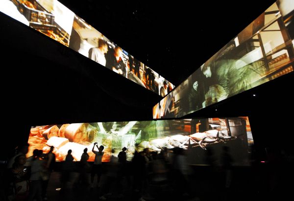 People visit Spanish Pavilion at the 2010 World Expo in Shanghai, east China, on May 5, 2010. The multimedia and lumia show at the 2010 World Expo attracted so many tourists. 