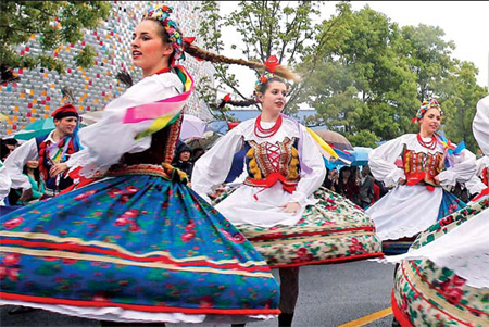 Dancers perform during Sunday's parade to celebrate Europe Day at the Expo Garden.