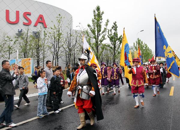 Performers march at the 2010 World Expo site in Shanghai May 9, 2010. A parade was held to mark the European Day special celebrations on Sunday at the 2010 World Expo.