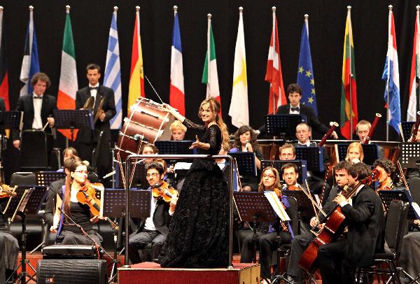 A Spanish conductress conducts a band during a concert held to mark the European Day at the 2010 World Expo in Shanghai May 9, 2010. 