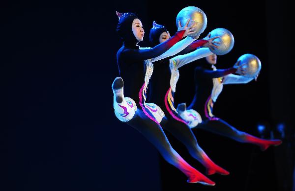 Tianjin acrobats perform during the 2010 Expo Tianjin Week at the 2010 World Expo in Shanghai, east China, May 9, 2010.