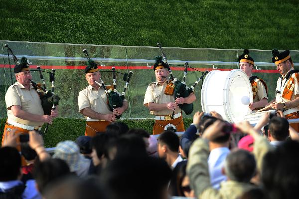 Members of a military band perform bagpipes in front of the Ireland Pavilion in the World Expo park in Shanghai, east China, May 11, 2010. The military band will perform for visitors in Shanghai from May 9 to 12.