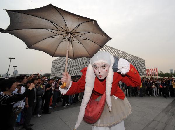 A man in the costumes of Narnia series performs in the World Expo Park in Shanghai, east China, May 10, 2010. Performers in various traditional costumes attract many visitors with their programs in District C of the World Expo.