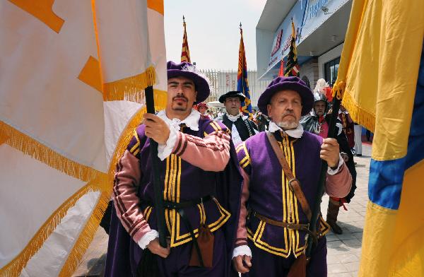 Men dressed as ancient knights of the Malta Pavilion walks in the World Expo Park in Shanghai, east China, May 11, 2010. 