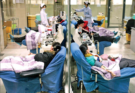 Villagers from across Yunxian County in Hubei Province donate their blood plasma at the county collection center. China's plasma donors are usually rural residents from poor regions.