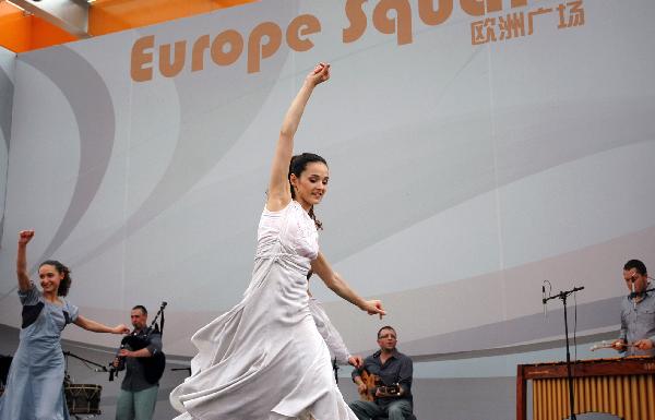 Performers from a Spain's Galicia dancing troupe dance during the Galicia week event held by the Spain Pavilion at the 2010 World Expo in Shanghai, east China, May 18, 2010.