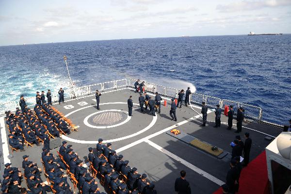 Chinese Navy soldiers exercise on the deck of destroyer DDG-168 Guangzhou during their escort mission in the Gulf of Aden, May 18, 2010.