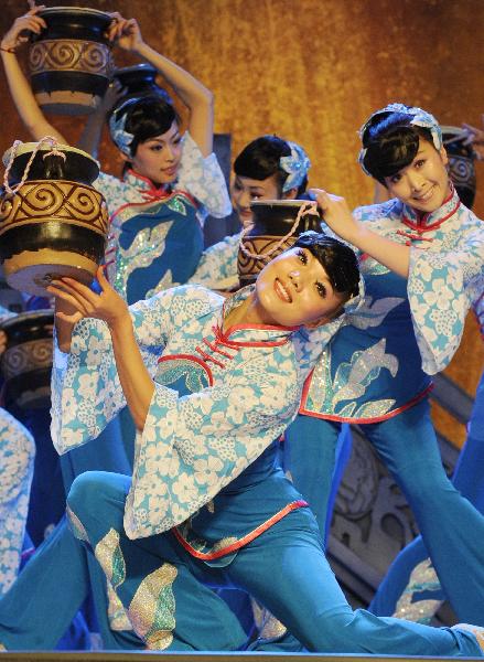 Dancers from Shanxi perform on the Baosteel Stage at the 2010 World Expo in Shanghai, east China, May 20, 2010.