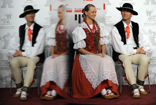 Dancers Adam Chmielniak (R) and Milana Burchardt attend the press conference for the National Pavilion Day of Poland at the 2010 World Expo in Shanghai, east China, May 21, 2010.