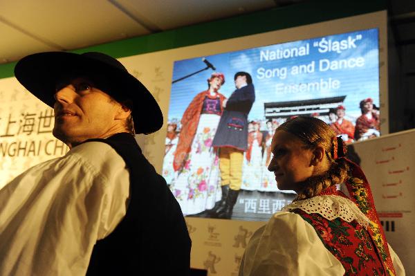 Dancers Adam Chmielniak (L) and Milana Burchardt attend the press conference for the National Pavilion Day of Poland at the 2010 World Expo in Shanghai, east China, May 21, 2010. 