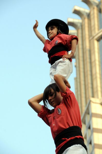 Performers from Spain stack themselves up during the Castell (means castle in Catalan) performance in the Nanjing Pedestrian Street of Shanghai, east China, May 23, 2010. The Castell performance, a traditional folk celebration in Catalonia of Spain, will also be shown in the Expo Park from May 24 to 30. 