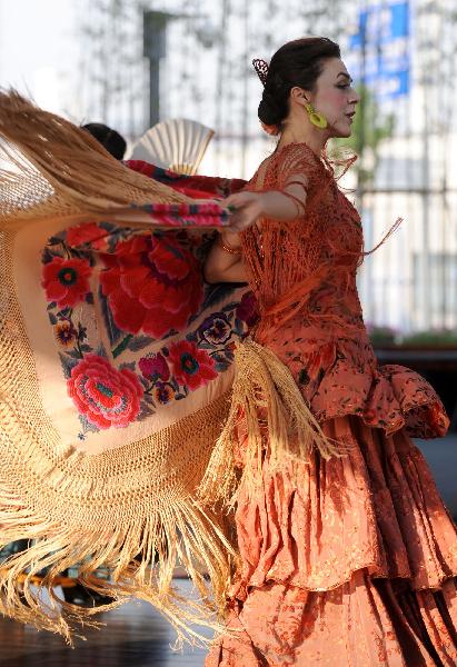 An actress from Spain performs dances at Madrid Pavilion in the Urban Best Practices Area (UBPA) in the World Expo Park in Shanghai, east China, May 24, 2010. 