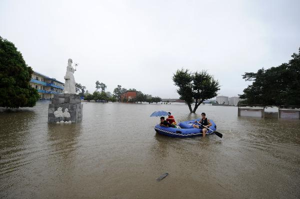 Laibin City Experimental Middle School is besieged by flood caused by heavy rains in Laibin, southwest China's Guangxi Zhuang Autonomous Region, June 1, 2010. It is said 11 townships in Guangxi have received more than 300 millimeters of rain since Monday night, with several suffering from flooding.