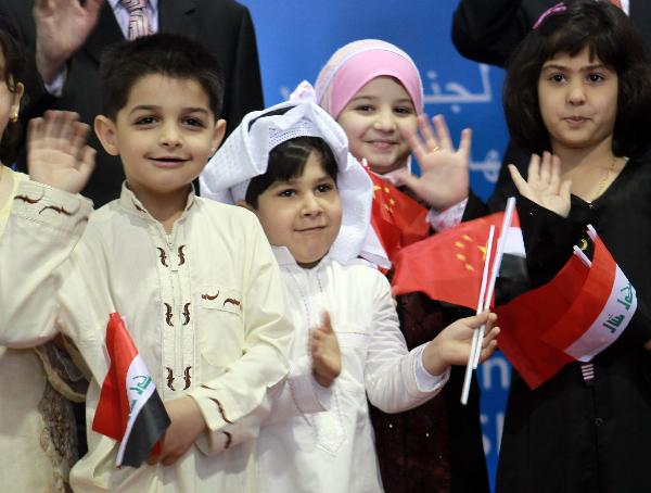 Iraqi children pose for a group photo at the Iraq Pavilion at the World Expo Park in Shanghai, east China, June 1, 2010, International Children's Day. The Iraq Pavilion was opened to the public here on Tuesday. 