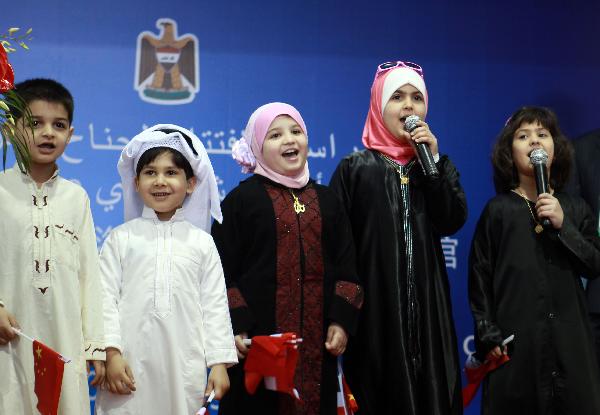 Iraqi children sing a Chinese children's song at the Iraq Pavilion at the World Expo Park in Shanghai, east China, June 1, 2010, International Children's Day. The Iraq Pavilion was opened to the public here on Tuesday. 