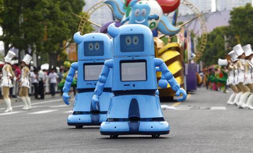 Haibao robots march in the Shanghai Expo Park, June 1, 2010. A total of 20 Expo mascot robots made up a team to walk in the Expo Park as Children's Day was celebrated there, attracting lots of visitors.